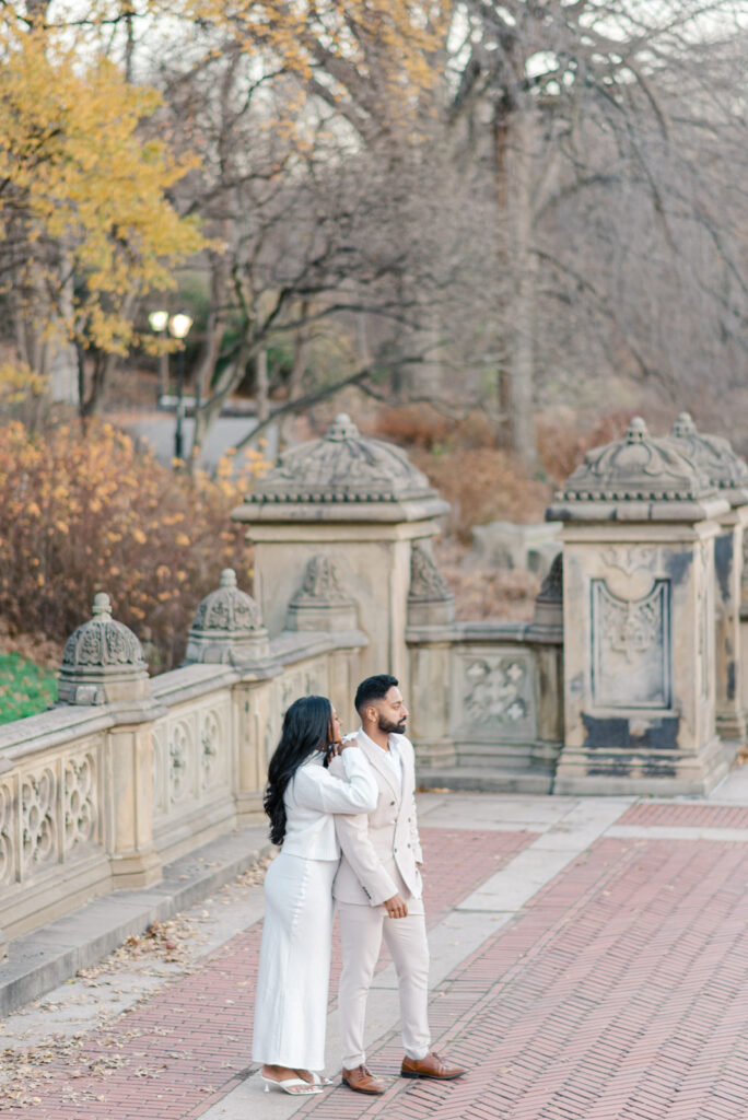 editorial pre-wedding image of a couple looking into the distance at central park