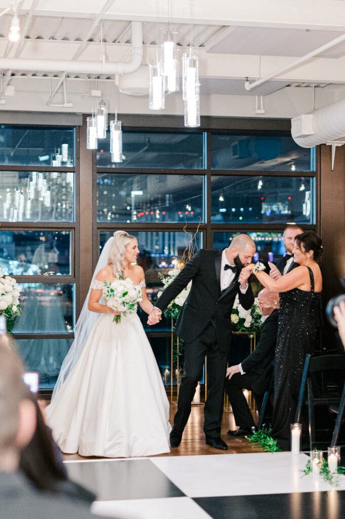 wedding couple leaving their indoor ceremony