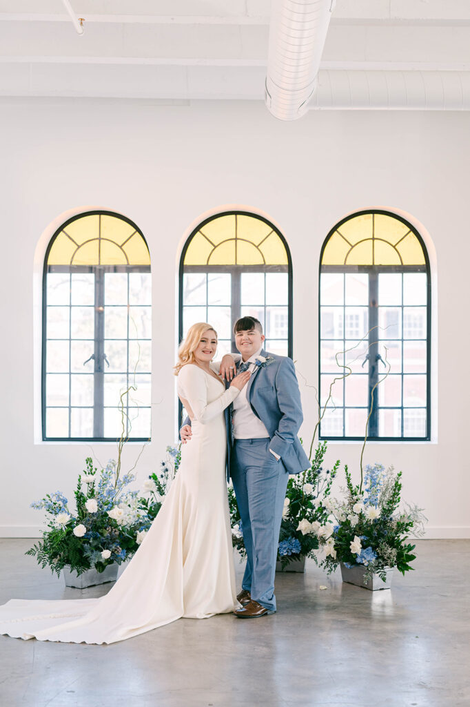 classic wedding portrait of a lesbian couple in front of their wedding ceremony location