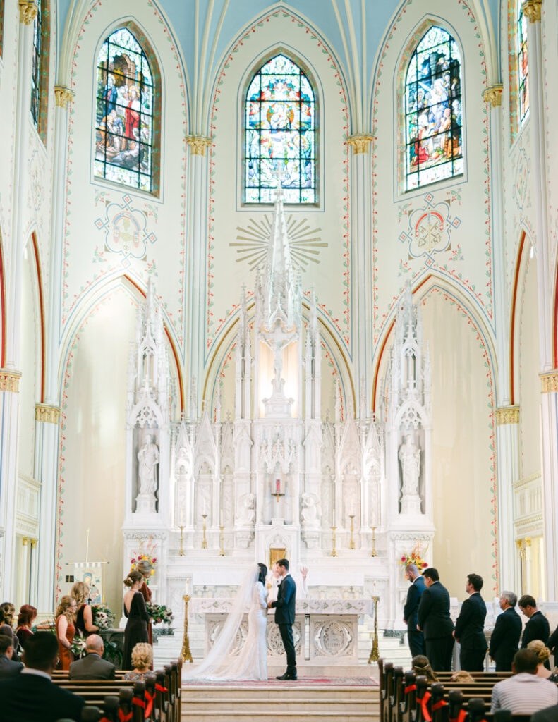wedding ceremony photo of a couple at the kansas city redemptorist church