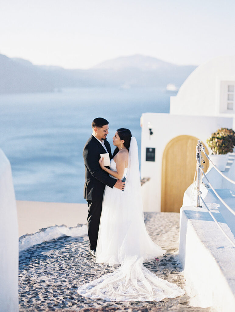 couple reading vows at their greece santorini wedding elopement